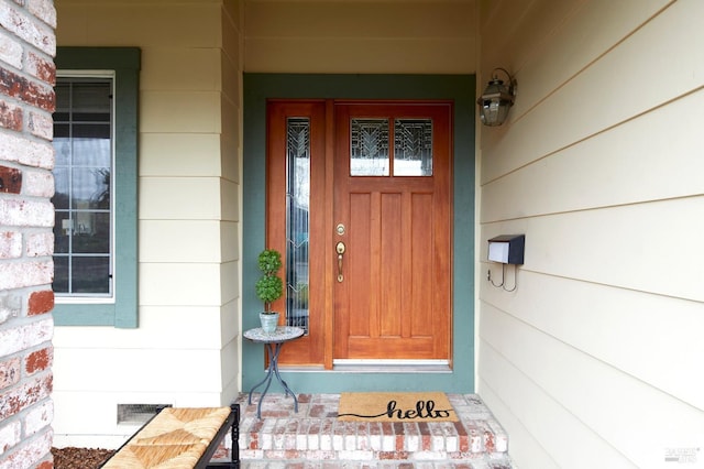 doorway to property with visible vents