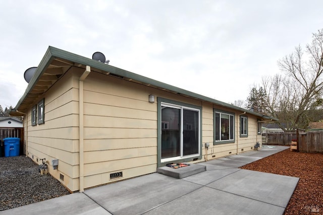 back of house with a patio and fence