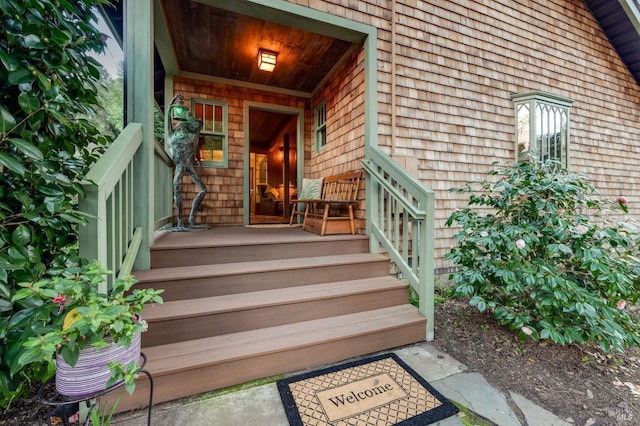 view of exterior entry with covered porch