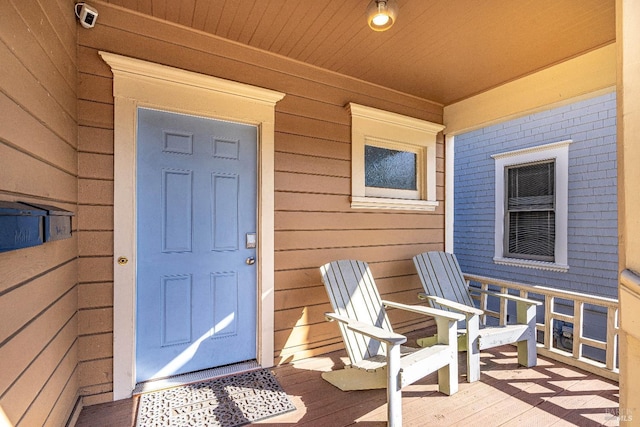 doorway to property with covered porch