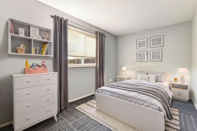 bedroom featuring baseboards