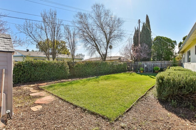 view of yard with a fenced backyard