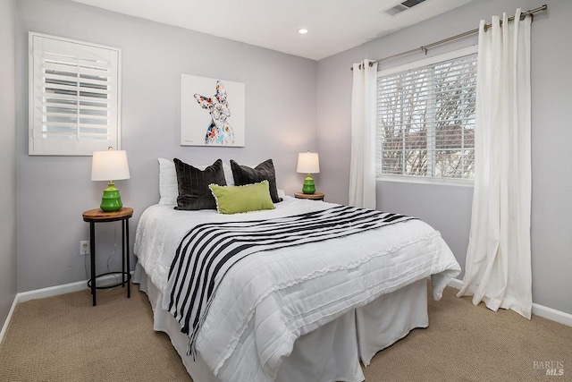 carpeted bedroom with recessed lighting, visible vents, and baseboards