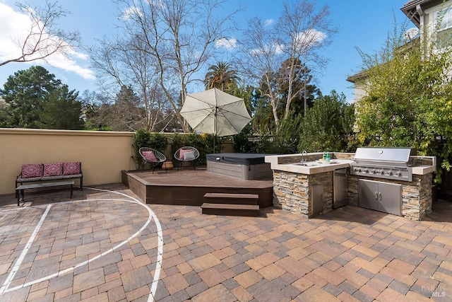 view of patio featuring an outdoor kitchen and a grill