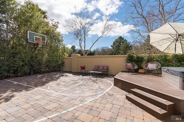 view of patio / terrace with a hot tub