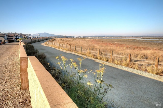 view of street with a water and mountain view