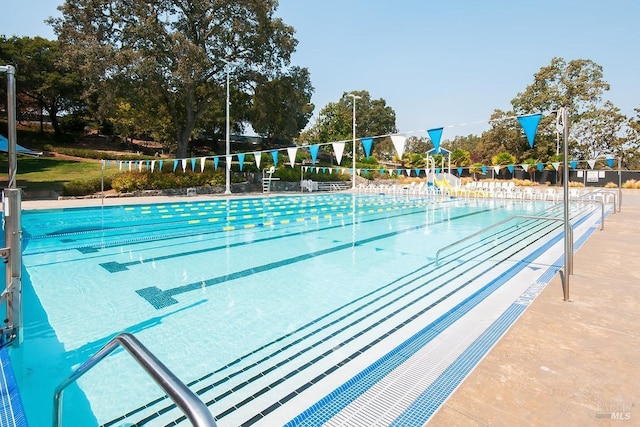 view of pool with fence