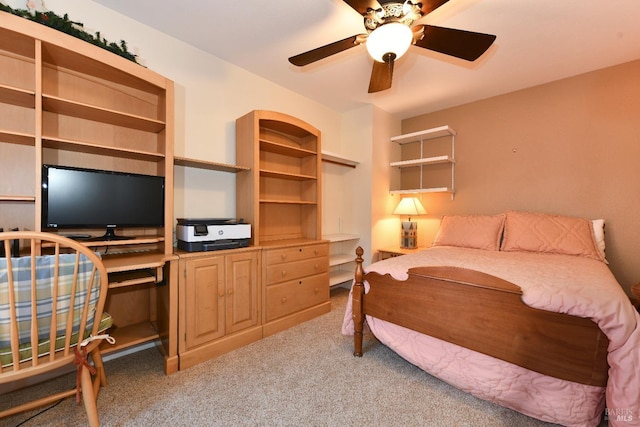 bedroom with ceiling fan and carpet flooring