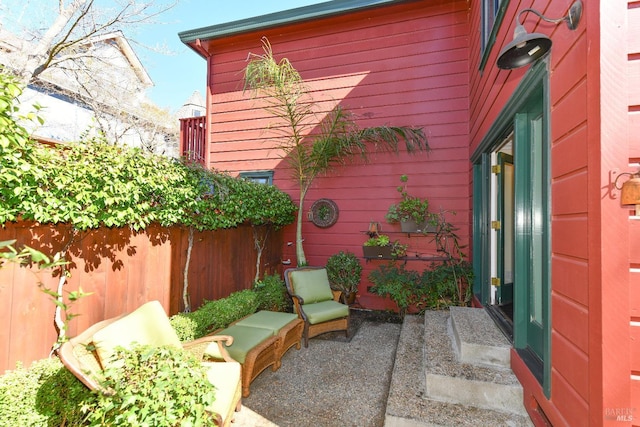 view of patio / terrace featuring fence