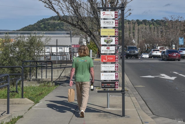 view of street with sidewalks and a mountain view