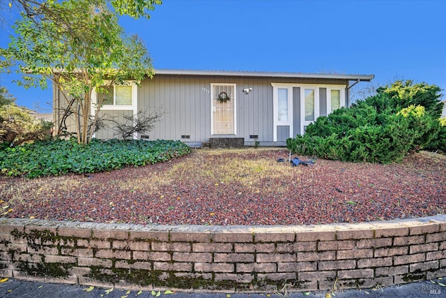 view of front of house featuring crawl space