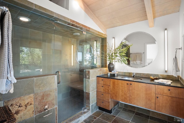 full bathroom with a stall shower, wood ceiling, vaulted ceiling with beams, stone tile flooring, and vanity