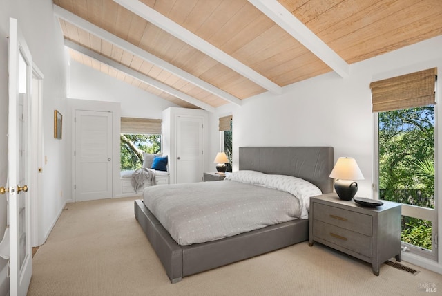 bedroom with access to exterior, carpet, vaulted ceiling with beams, visible vents, and wooden ceiling