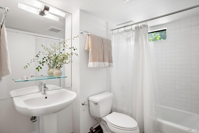 full bath featuring shower / bath combination with curtain, visible vents, and toilet