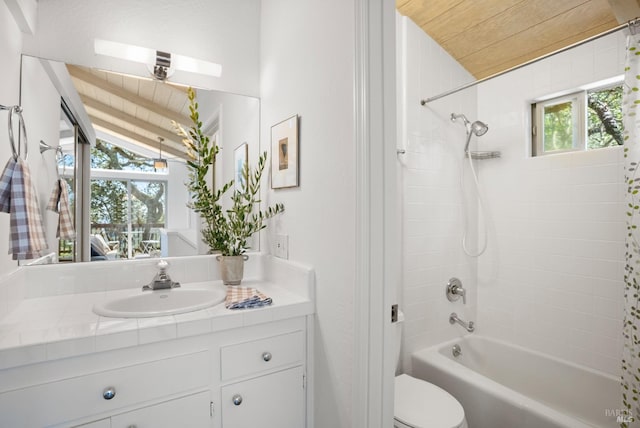 bathroom with lofted ceiling, wood ceiling, vanity, and shower / bathtub combination