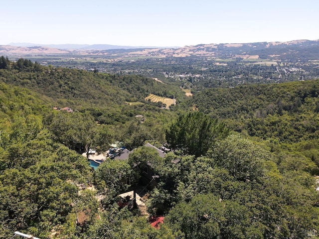 bird's eye view featuring a mountain view and a wooded view