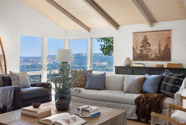 living room with vaulted ceiling with beams and wooden ceiling