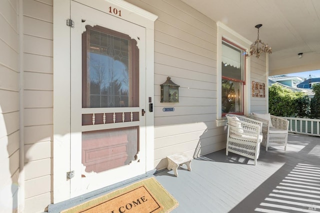 view of exterior entry with covered porch