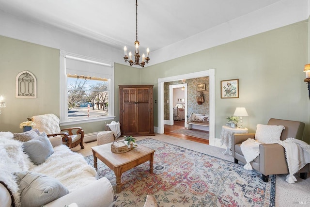 living room with baseboards and a chandelier