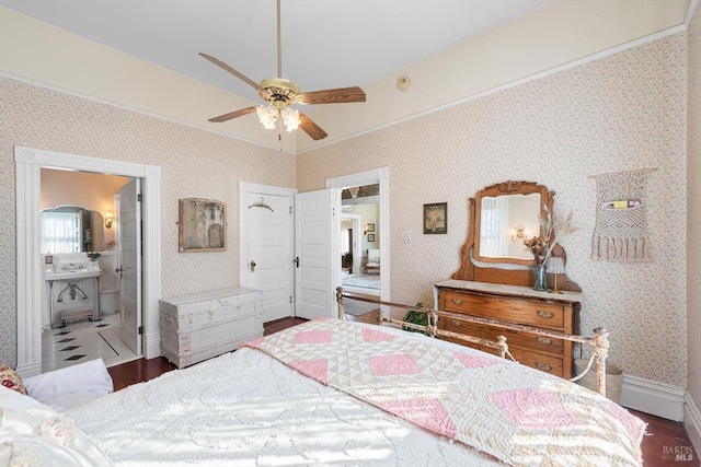 bedroom featuring ornamental molding, wallpapered walls, baseboards, and wood finished floors