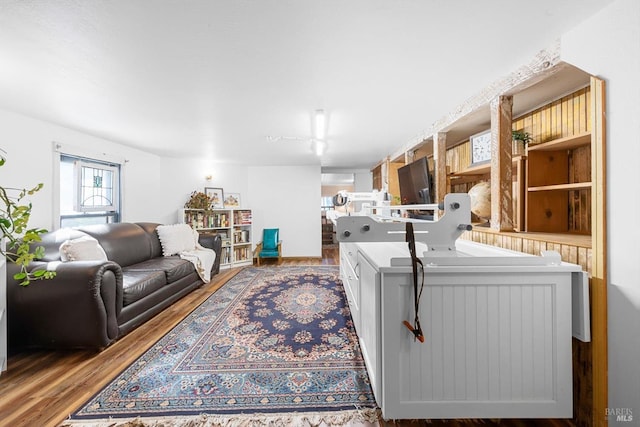 bathroom featuring wainscoting, toilet, and a sink