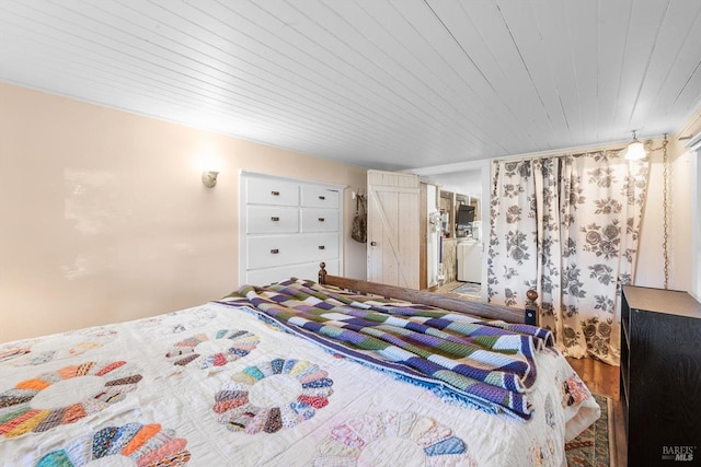 bedroom featuring wood ceiling and wood finished floors