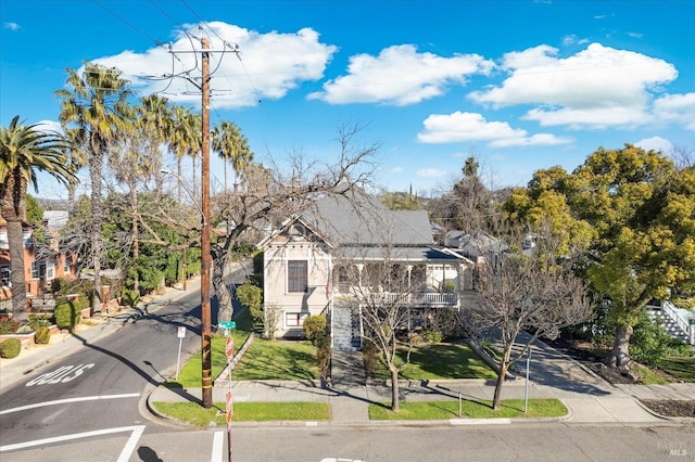 detached garage featuring fence
