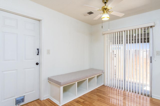 mudroom with light wood-type flooring, visible vents, baseboards, and a ceiling fan