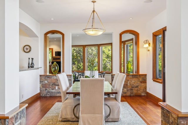 dining area featuring recessed lighting, baseboards, and wood finished floors