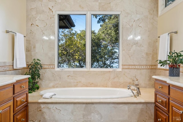 bathroom featuring a bath and vanity