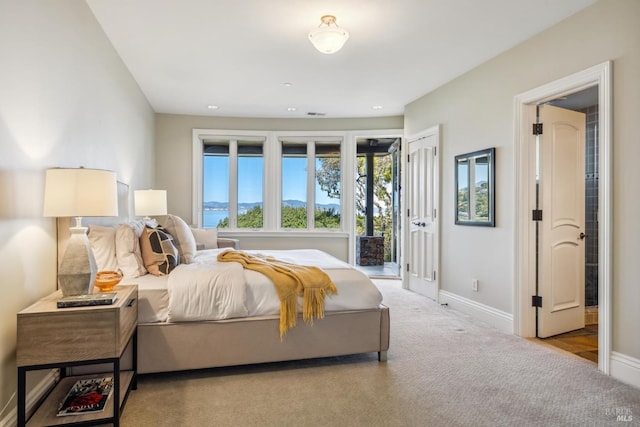 carpeted bedroom featuring recessed lighting and baseboards