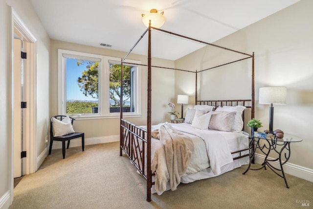 bedroom featuring baseboards, visible vents, and carpet flooring