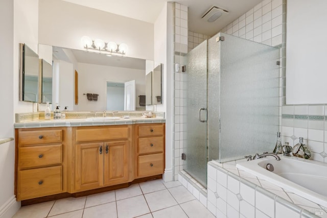 full bathroom featuring visible vents, a stall shower, vanity, tile patterned flooring, and a bath