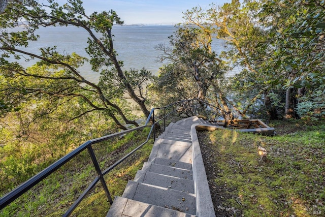 surrounding community featuring a water view