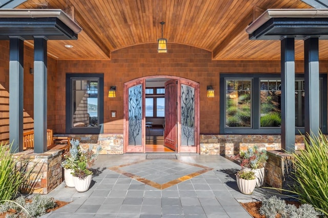 entrance to property with stone siding and french doors