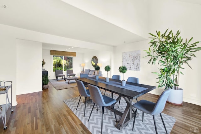 dining area featuring wood finished floors and baseboards