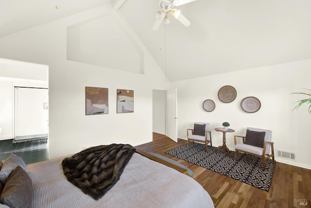 bedroom with high vaulted ceiling, ceiling fan, visible vents, and wood finished floors