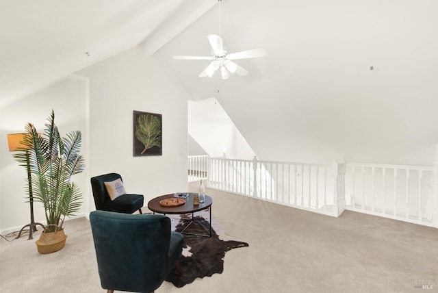 living area with carpet floors, vaulted ceiling with beams, and a ceiling fan