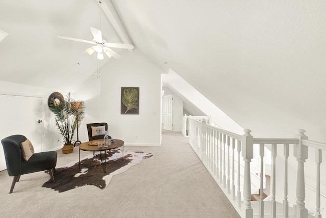 living area with carpet, a ceiling fan, high vaulted ceiling, beamed ceiling, and baseboards