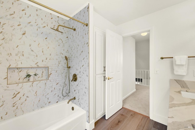 full bath with shower / bathtub combination and wood finished floors