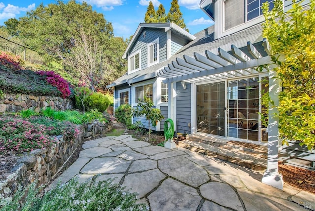 back of house featuring a patio area and a pergola