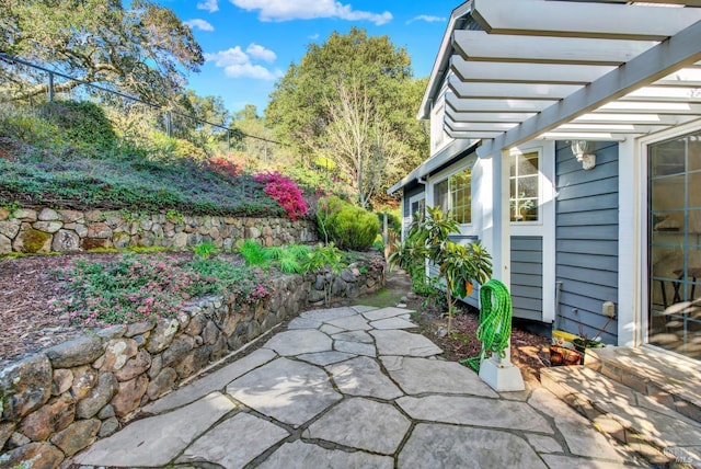 view of patio with fence and a pergola