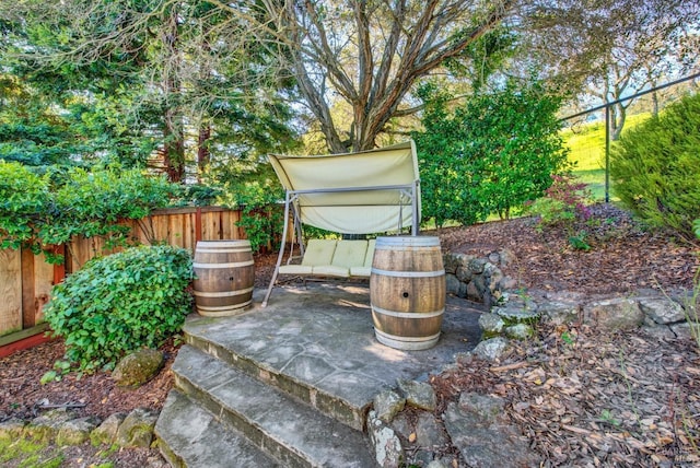 view of patio / terrace featuring fence