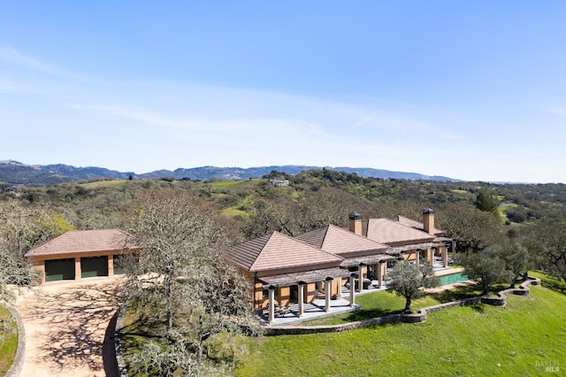 bird's eye view featuring a mountain view and a view of trees