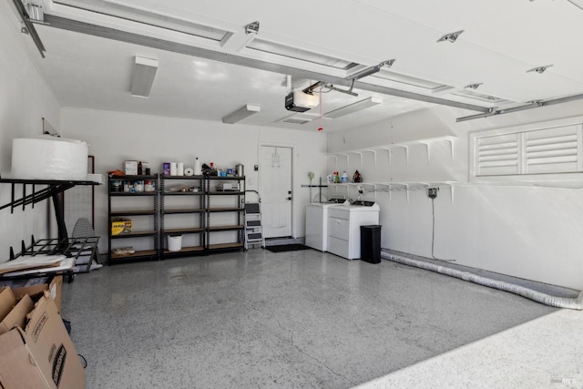 garage featuring a garage door opener and washer and clothes dryer