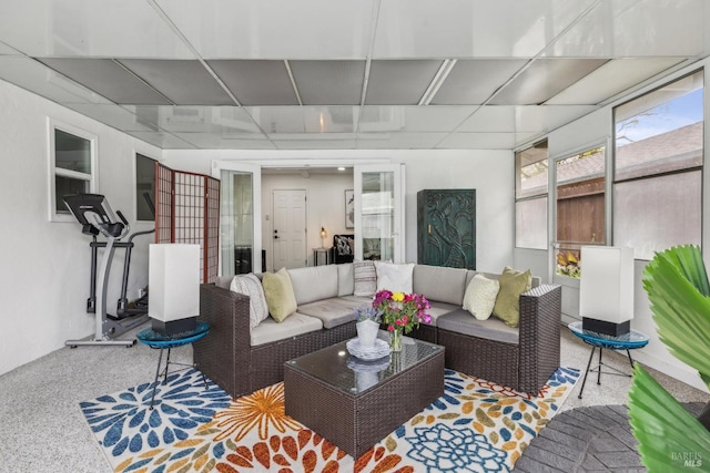 living area with speckled floor