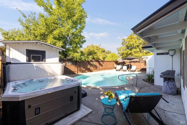 view of swimming pool with a fenced in pool, area for grilling, a patio area, a fenced backyard, and a hot tub