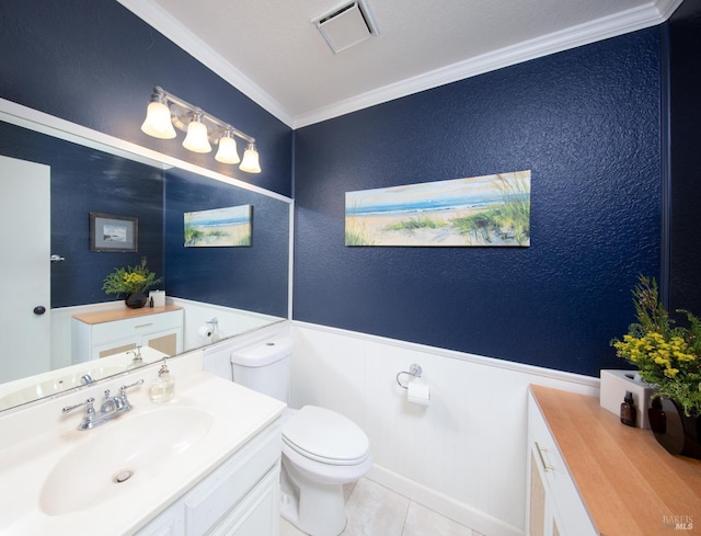 bathroom with visible vents, toilet, tile patterned floors, crown molding, and vanity