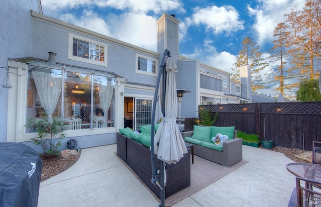 exterior space featuring a fenced backyard and outdoor lounge area