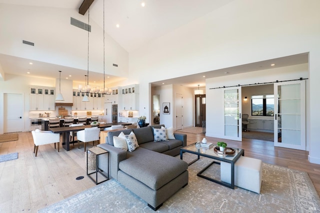 3878 Horizon View Way, Santa Rosa, CA 95404 - living room featuring light wood-type flooring, high vaulted ceiling, beamed ceiling, a barn door, and recessed lighting